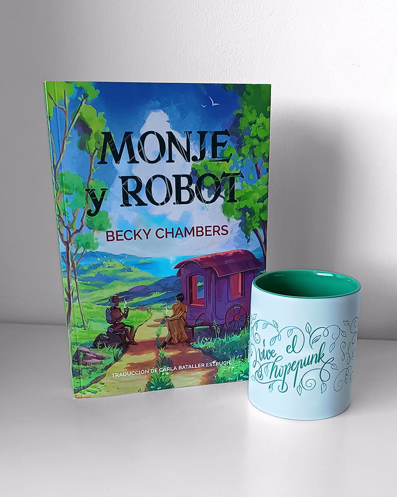 Fotografía del libro de Monje y robot, de Becky Chambers, acompañado por la taza "vive el hopepunk"